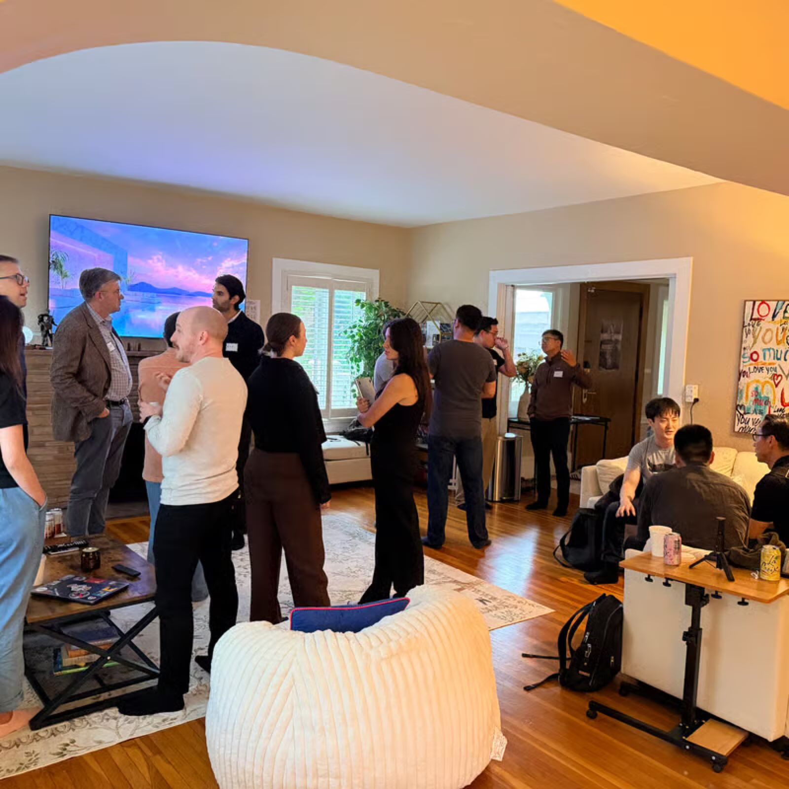 Founders watching a demo on the screen at the Lovie house
