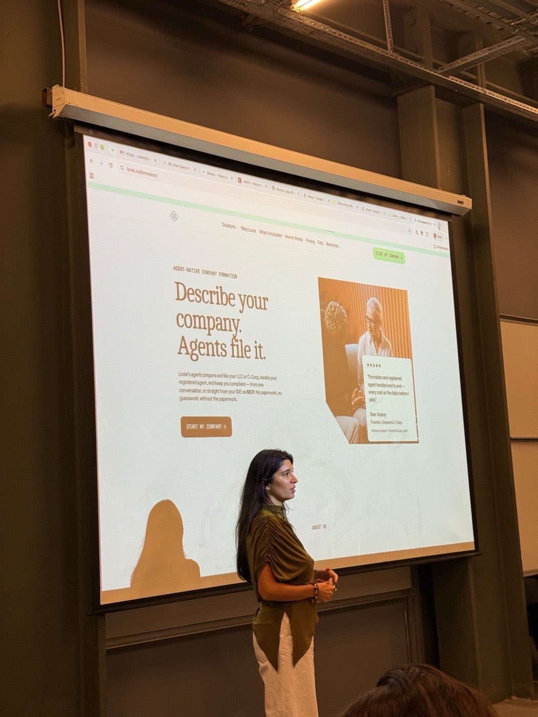 A founder presenting to a room at the Lovie house